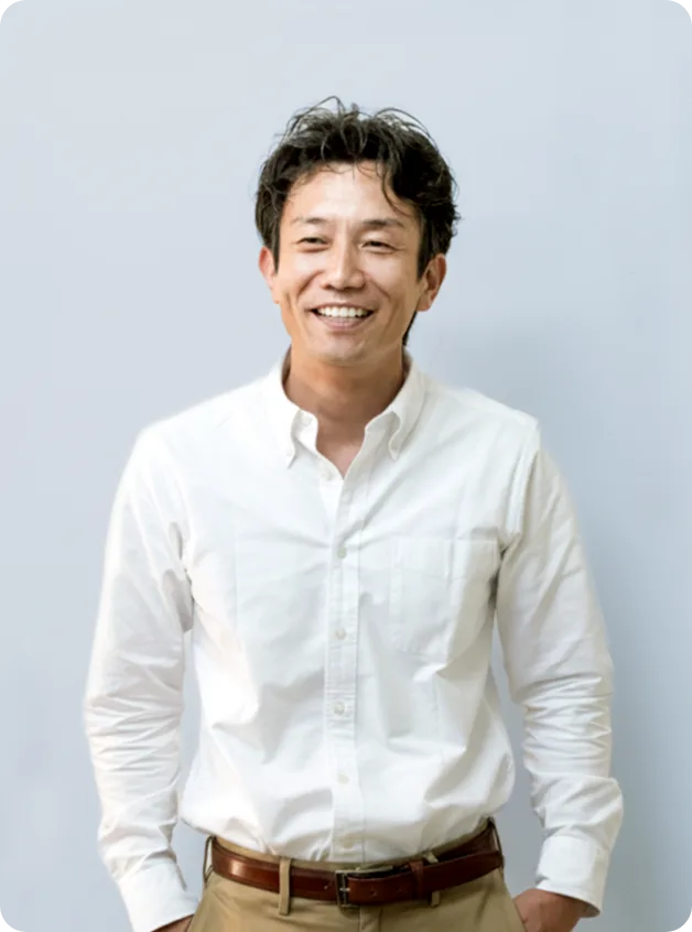 Ando Tatsuhiko, COO of Cody Web Development Inc., smiling in a professional portrait.