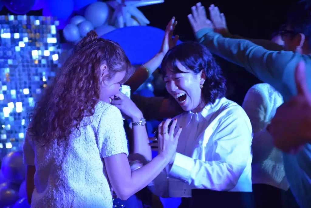 Candid moment of Cody Web Development team laughing and celebrating during the Christmas and Year-End Party.